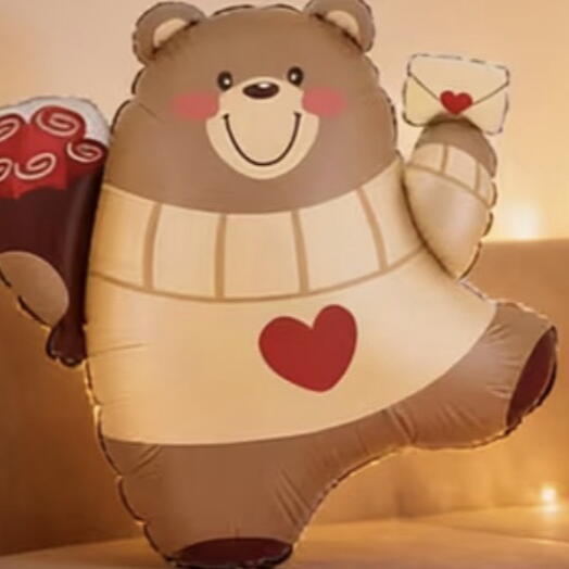 Inflatable teddy bear with flowers and a letter-shaped balloon