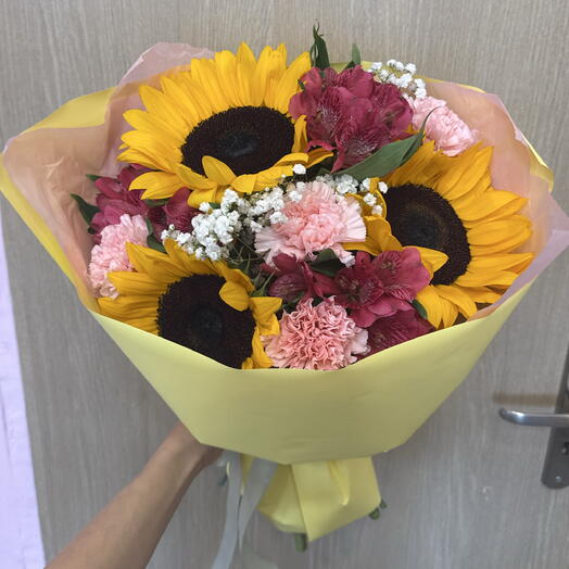 A bouquet of flowers with sunflowers