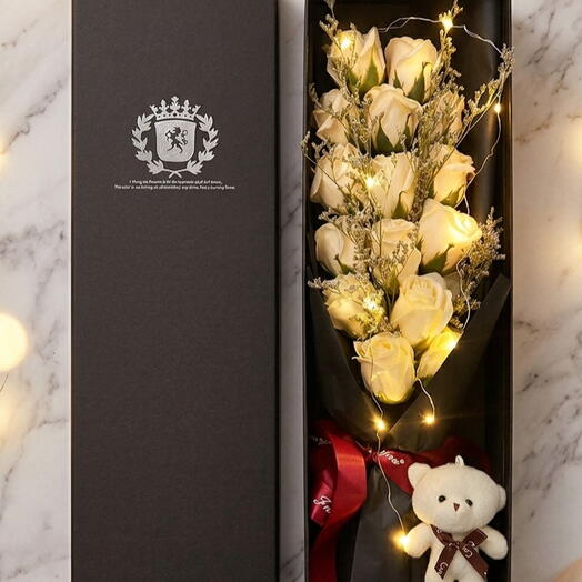 Beige color Flowers in a box with teddy bear and led light installed for your special occasion