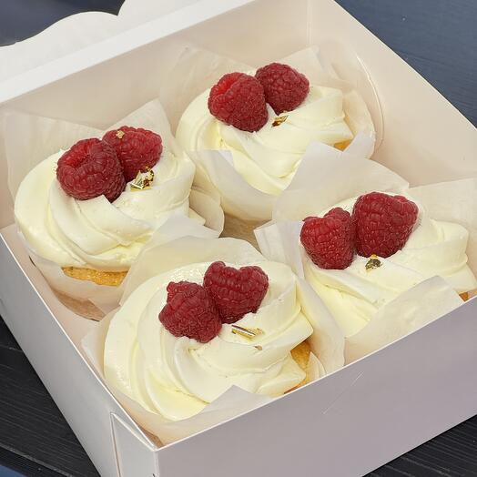 Vanilla cupcakes with raspberries and edible gold