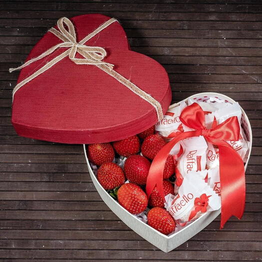 Strawberries with Raffaello candies in a box