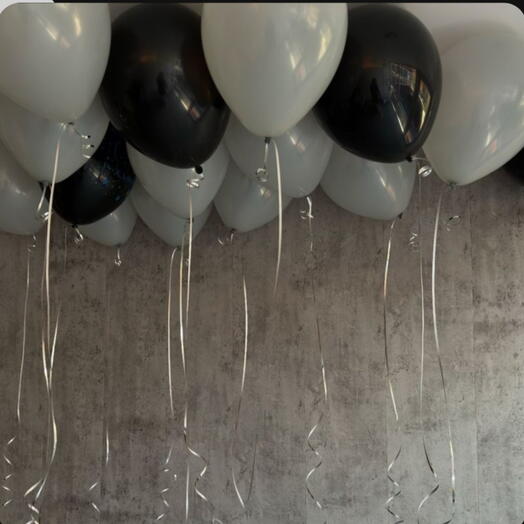 Flying black-and-white balloons