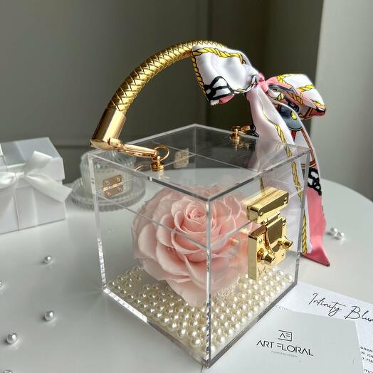 Eternal rose in a pink acrylic cube