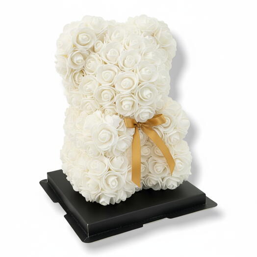 White teddy bear made of foam roses, everlasting artificial roses, rose teddy bear in packaging