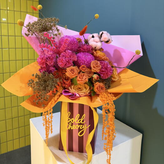 Orange and Pink bouquet in a bag