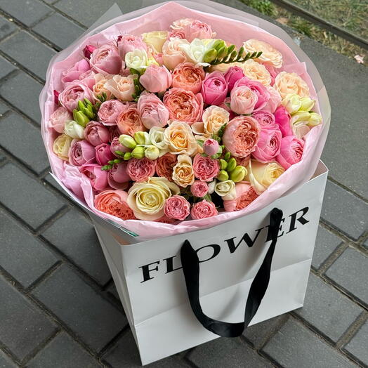 Bouquet of mix roses in the branded bag