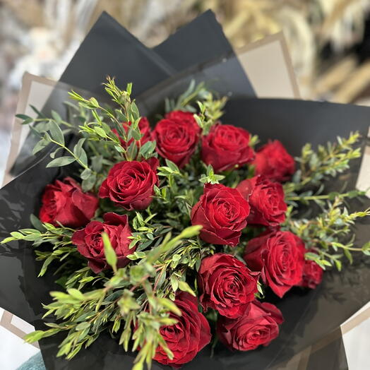 Red roses bouquet with greenery