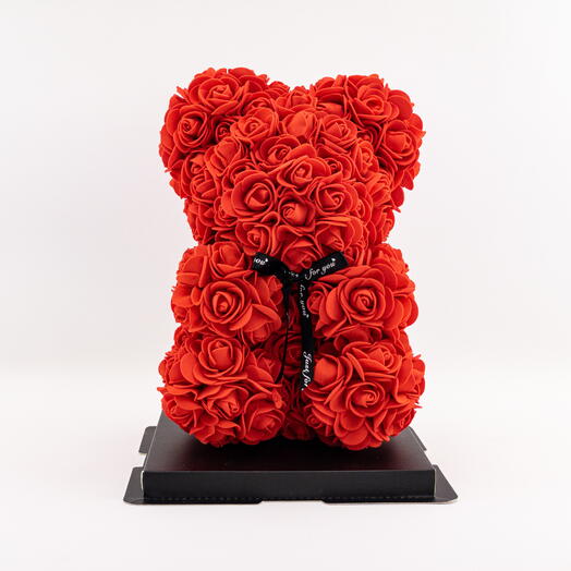 Red teddy bear made of foam roses