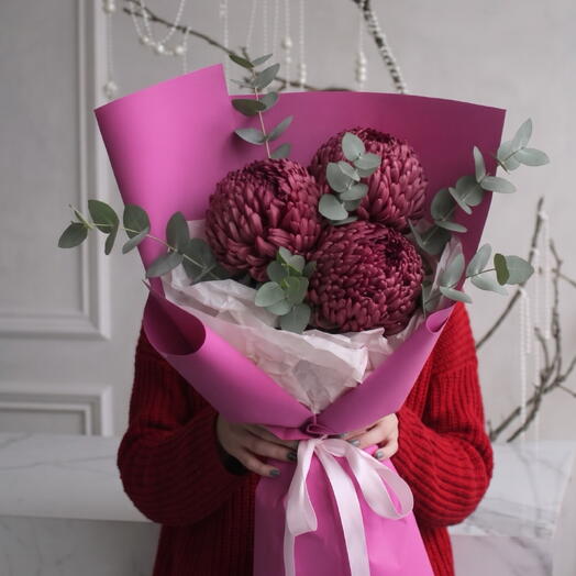 A bouquet of 3 burgundy chrysanthemums