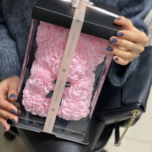 Pink teddy bear made of foam roses