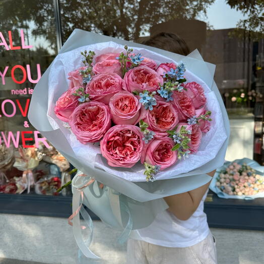 Bouquet of peony roses and oxypetalum