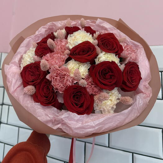 A bouquet of red roses with carnations