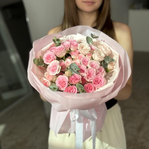 A bouquet of spray roses and eucalyptus