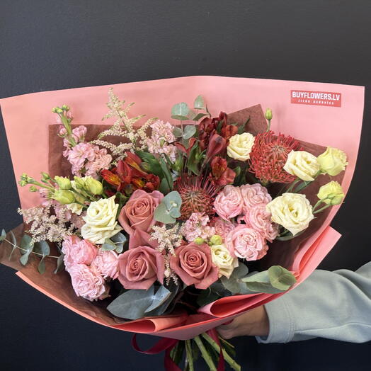 Bouquet of roses, alstroemeria, astilbe, lisianthus, and exotic flowers