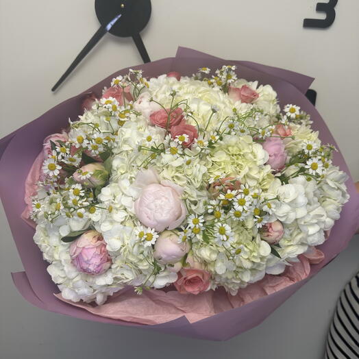Spring bouquet with peonies and daisies