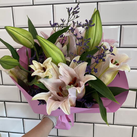 Bouquet with a lily and limonium