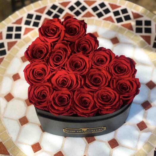 Eternal roses in a heart-shaped flowerbox