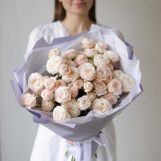 Bushy peony-shaped cream-colored roses in lavender decoration