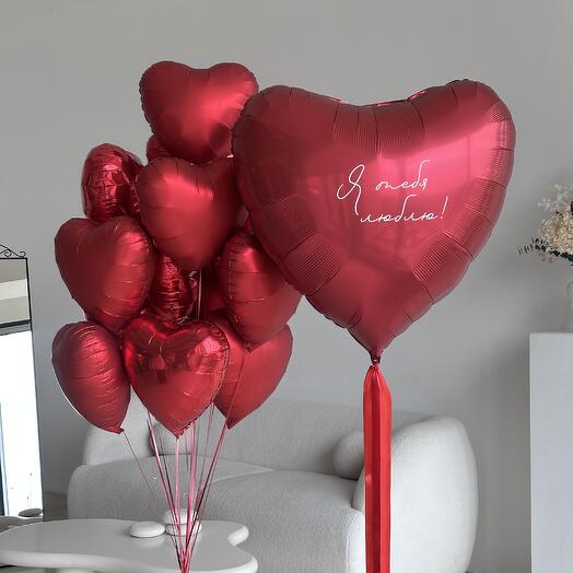 Big red heart with an inscription and a set of hearts