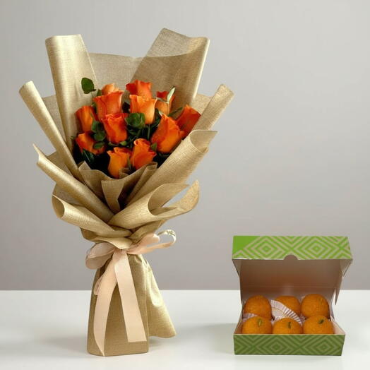 Orange Roses   Bikanervala Laddu Gift Combo | 12 Roses with 250g Sweets Dubai JVC