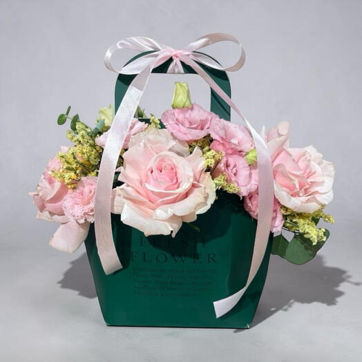 Pink roses in a paper bag